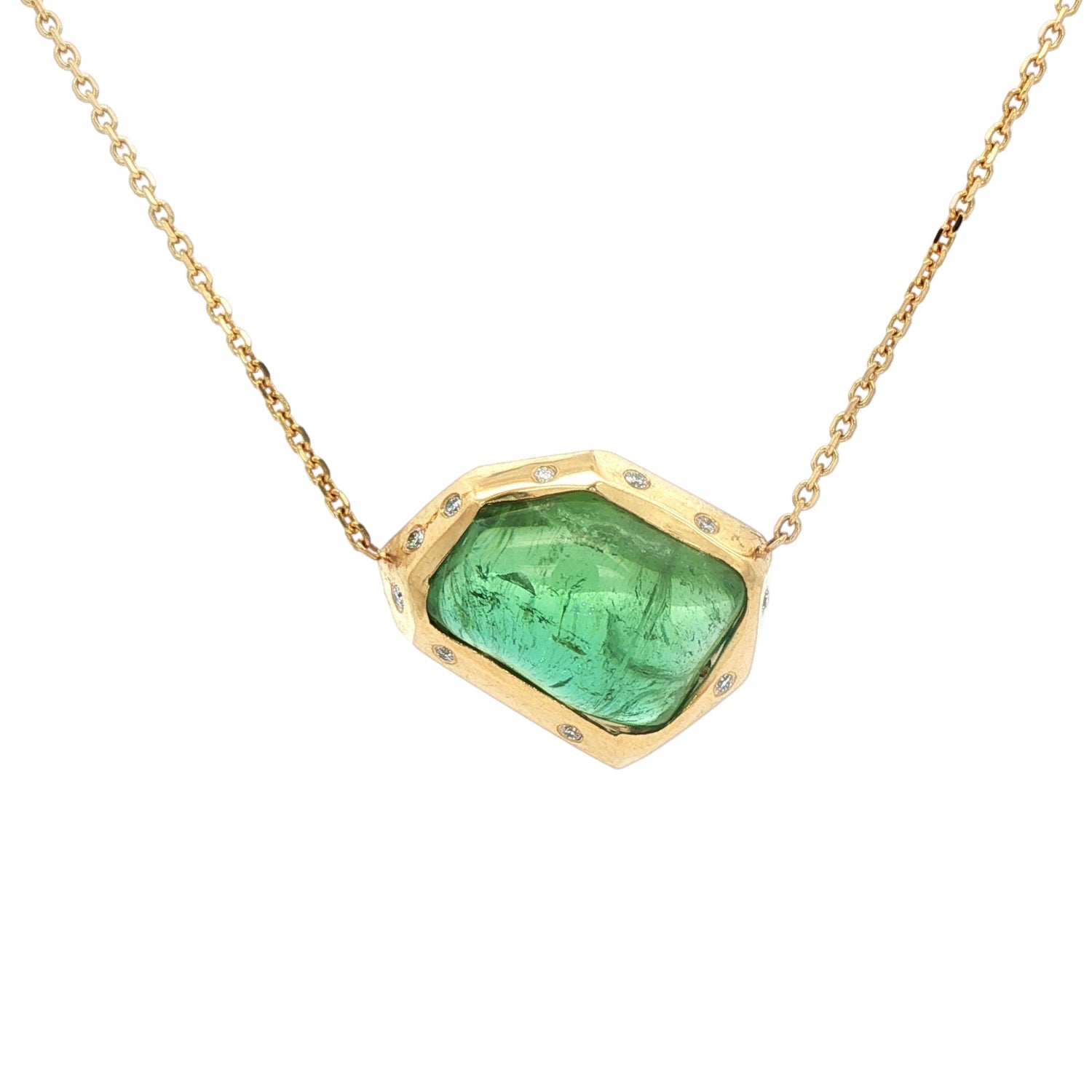 One-of-a-kind 18K yellow gold pendant featuring a 14.46ct freeform green tourmaline framed in a sculptural bezel with scattered diamond accents. Includes adjustable 16–18 inch gold chain.