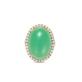 Luxurious 18K yellow gold halo ring featuring a luminous hand-carved chrysoprase cabochon, elegantly framed by brilliant-cut diamonds, blending natural beauty with timeless sophistication. Front close up. 