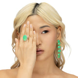 Luxurious 18K yellow gold halo ring featuring a luminous hand-carved chrysoprase cabochon, elegantly framed by brilliant-cut diamonds, blending natural beauty with timeless sophistication.