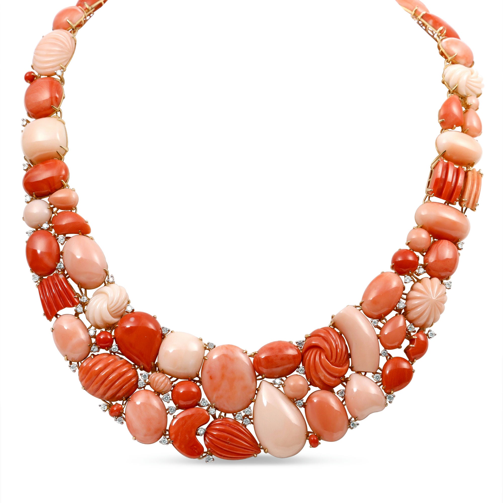Exquisite 18K yellow gold bib necklace featuring hand-carved coral gemstones in varying shapes and sizes, accented by delicately placed diamonds for added brilliance, creating a striking and timeless statement piece. Close up of front details. 