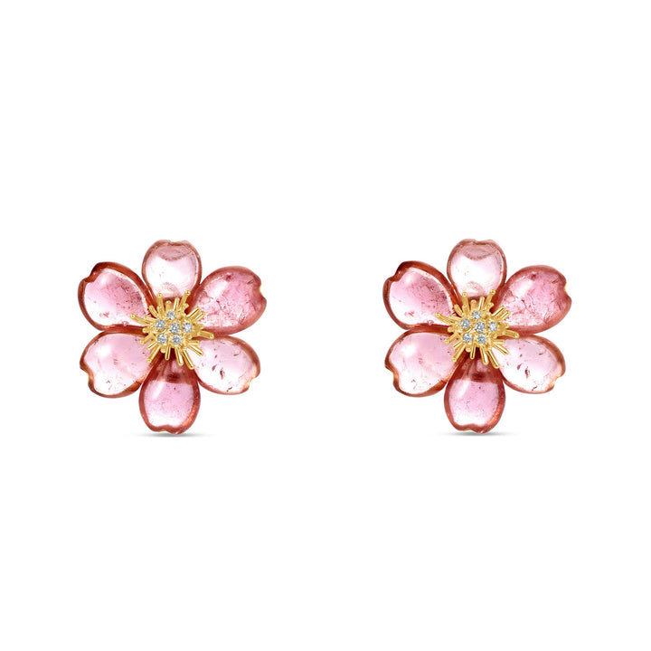 Exquisite one-of-a-kind 18K yellow gold clip-on stud earrings featuring meticulously hand-carved pink tourmaline plum blossoms, accented with sparkling diamonds for a refined and elegant floral statement. Close up front angle. 