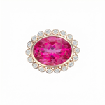 Hot pink topaz cocktail ring set in yellow gold with large round diamonds.
