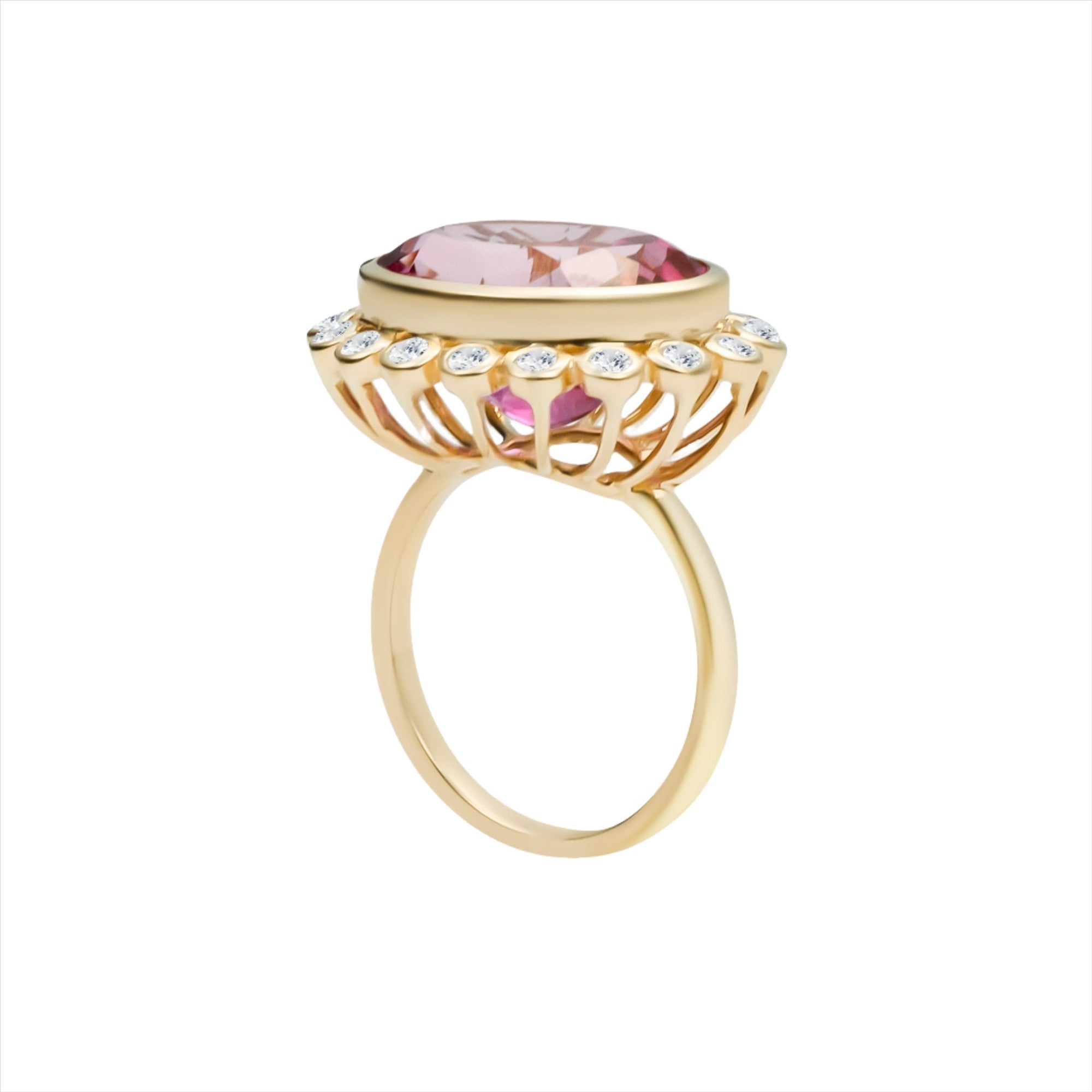 Bold 14K yellow gold cocktail ring featuring a vivid hot pink tourmaline center surrounded by a sparkling diamond halo in an elegant basket setting, designed to make a vibrant statement.