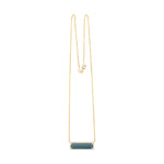 Exquisite 14K yellow gold bar necklace featuring a striking six-carat indicolite tourmaline, elegantly surrounded by a dazzling diamond halo for a timeless and eye-catching statement.