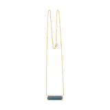 Exquisite 14K yellow gold bar necklace featuring a striking six-carat indicolite tourmaline, elegantly surrounded by a dazzling diamond halo for a timeless and eye-catching statement.