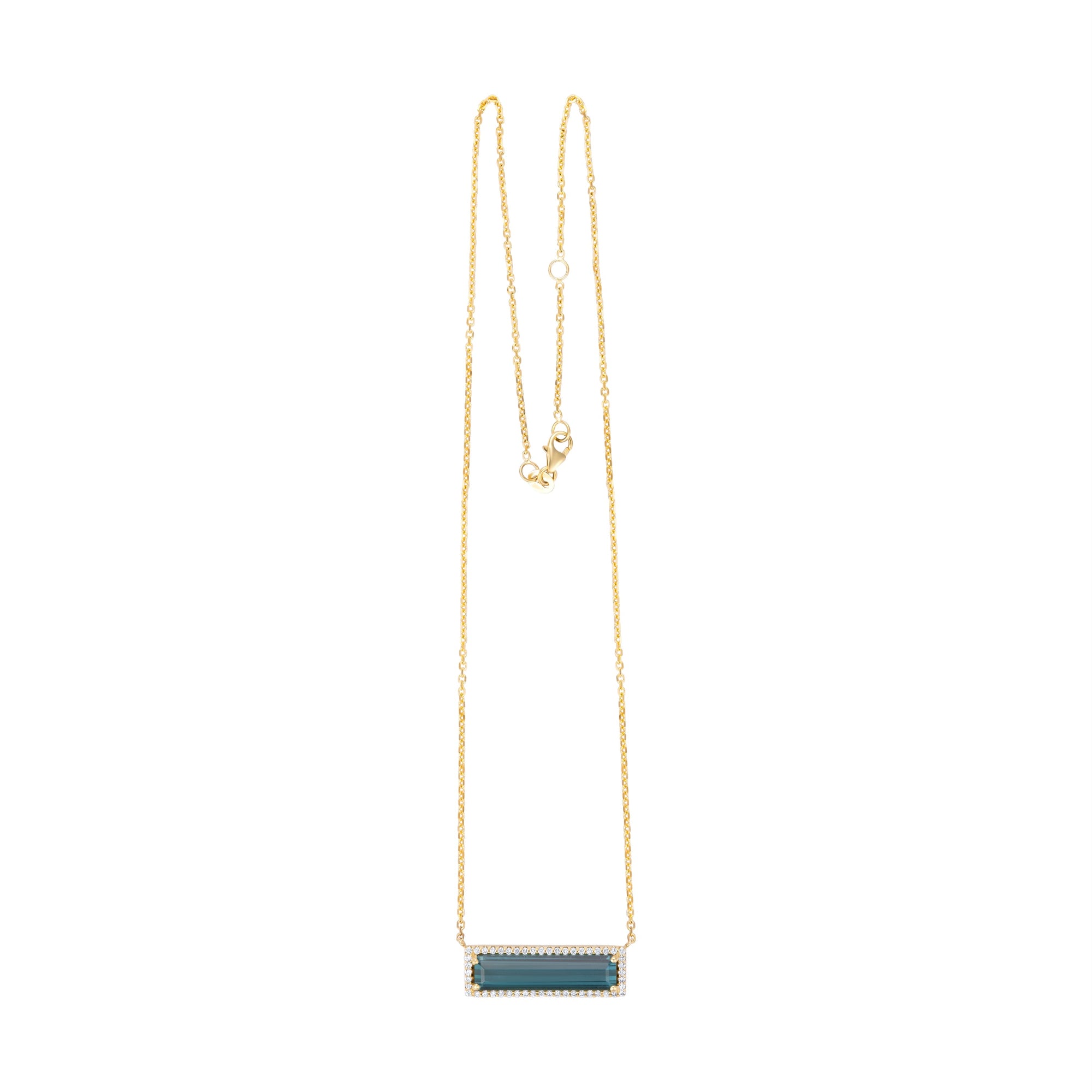 Exquisite 14K yellow gold bar necklace featuring a striking six-carat indicolite tourmaline, elegantly surrounded by a dazzling diamond halo for a timeless and eye-catching statement.