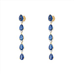 Elegant 14K yellow gold drop earrings featuring a linear design of pear-shaped kyanites totaling 4.96ct, each paired with a prong-set diamond (0.24ct total), for a refined and graceful look.