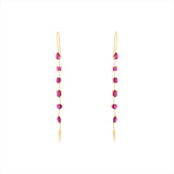 Refined 14K yellow gold linear drop earrings featuring six fancy-cut rubies in oval, princess, emerald, pear, solitaire, and marquis shapes, totaling 1.03ct and measuring 2.15 inches in length.