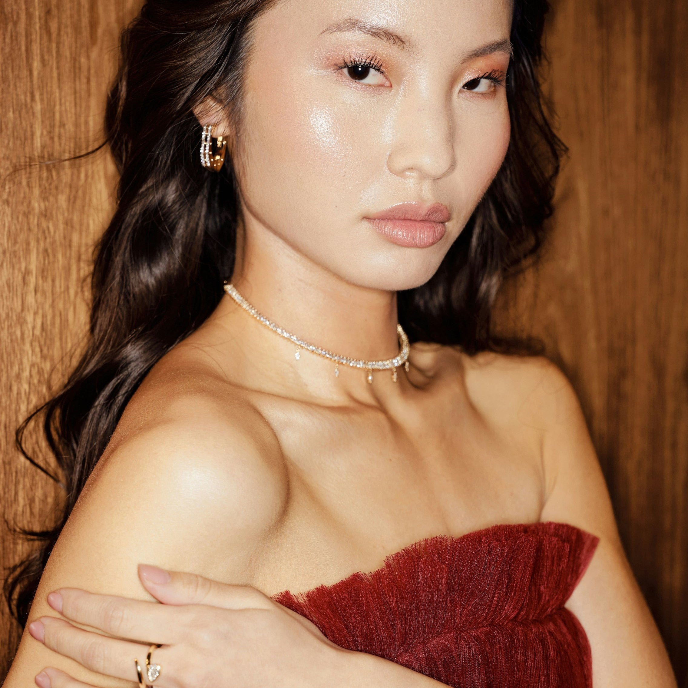 Chic 14K yellow gold choker featuring marquise-cut diamonds with delicate dangling accents, offering understated glamour and a modern twist for sophisticated styling. On body shot
