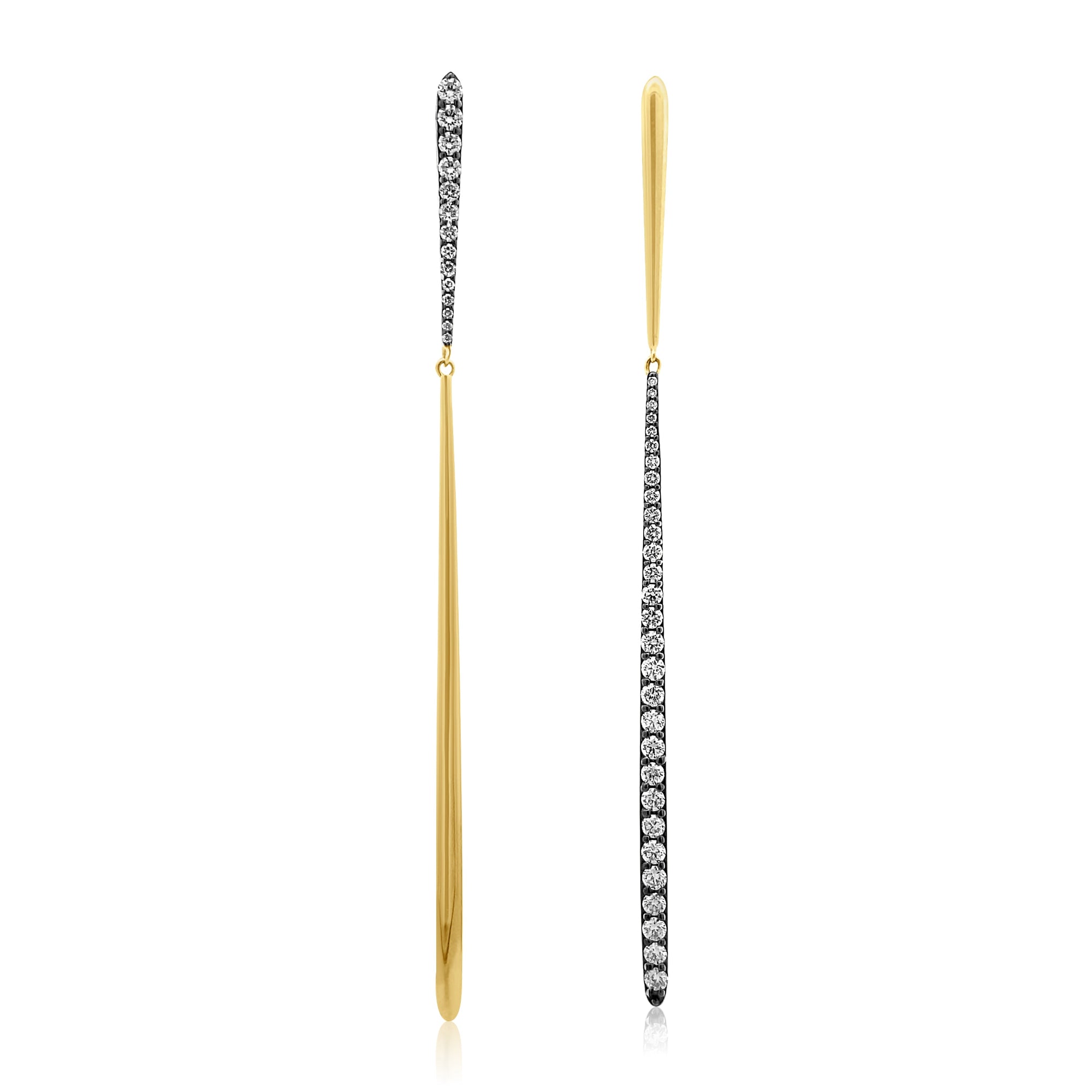 Stylish mismatched drop earrings crafted in 14K yellow and white gold, featuring sleek straight-line bar designs with alternating diamond accents for a unique and modern contrast. Close up. 