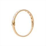 Refined 14K yellow gold bangle bracelet featuring 10 mixed-shape diamonds totaling 1.76ct, arranged in a sleek row for a timeless and elegant design.