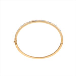 Refined 14K yellow gold bangle bracelet featuring 10 mixed-shape diamonds totaling 1.76ct, arranged in a sleek row for a timeless and elegant design.
