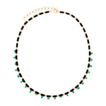 djustable 14K yellow gold necklace featuring 18ct of mixed-shape emerald and black onyx links, measuring 16 to 18 inches in length and weighing 18.15g—a bold and refined gemstone design.