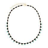 djustable 14K yellow gold necklace featuring 18ct of mixed-shape emerald and black onyx links, measuring 16 to 18 inches in length and weighing 18.15g—a bold and refined gemstone design.