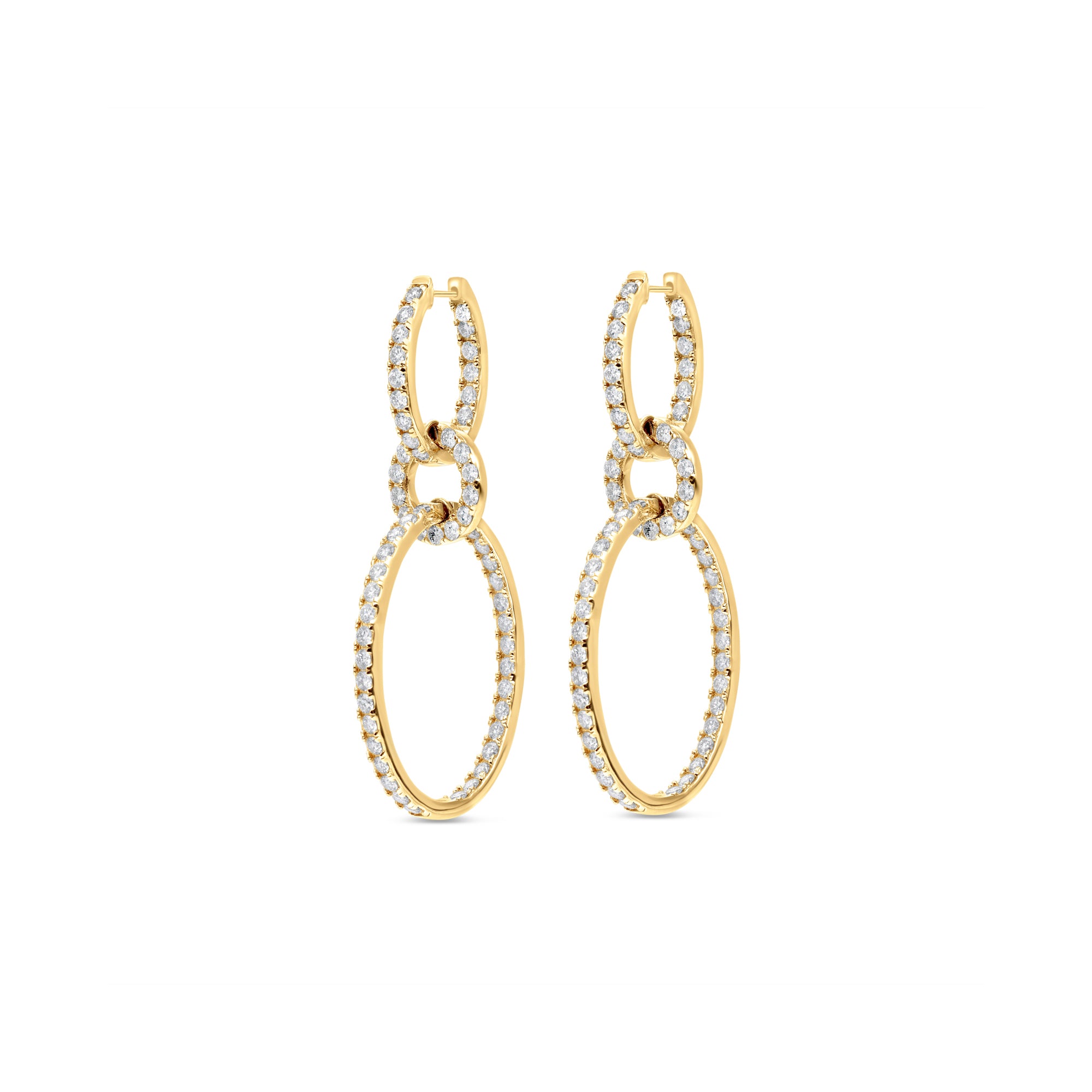 Luxurious multi-tier oval hoop earrings crafted in 14K yellow gold, featuring dazzling round diamonds set within elegant oval shapes, offering graceful movement and timeless sophistication. Side view close up. 