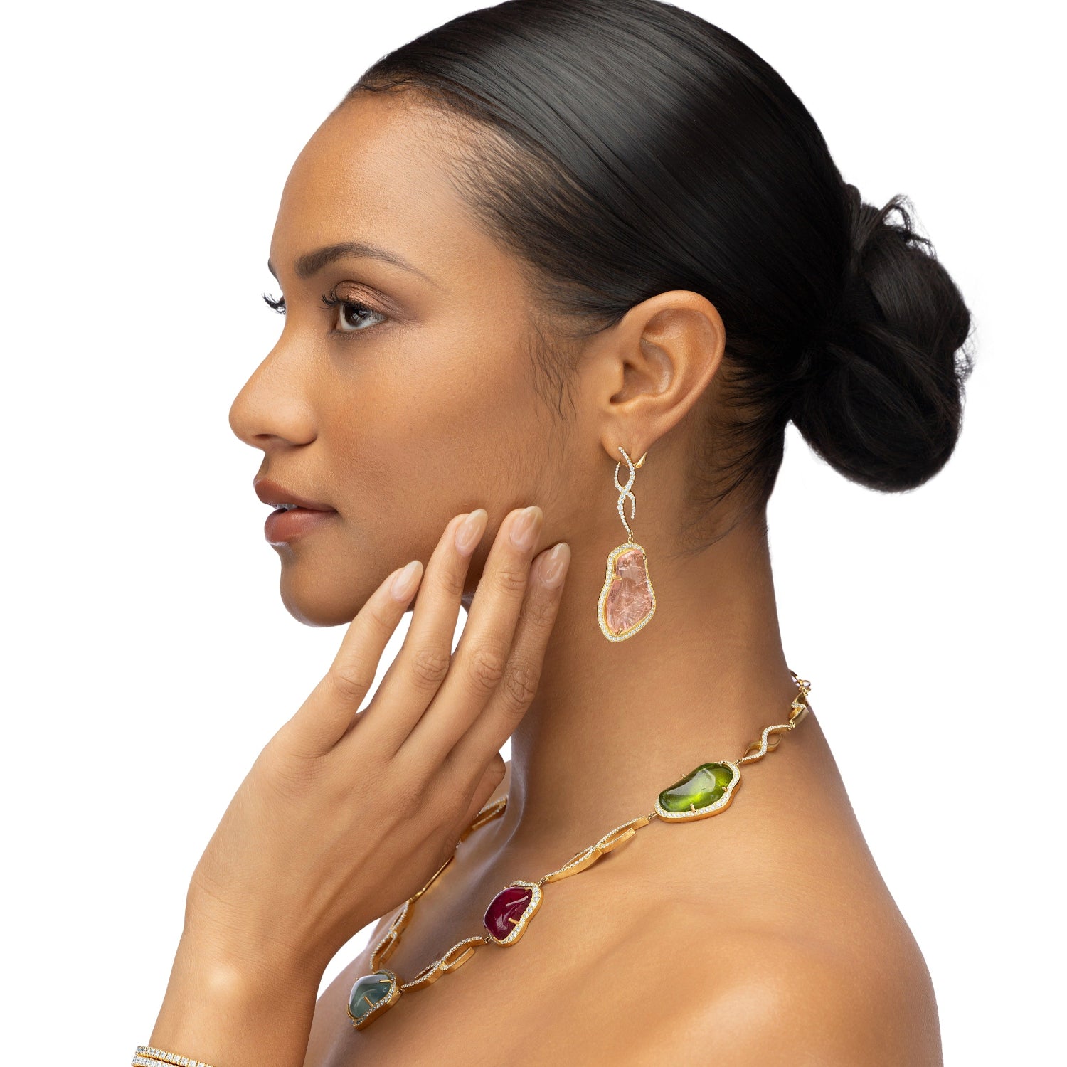 Statement necklace featuring freeform aqua, yellow beryl, pink tourmaline, and peridot gemstones with 8.36ct of D-color VVS1 diamonds, set in 118g of 18K yellow gold with adjustable length.