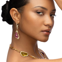 Statement necklace featuring freeform aqua, yellow beryl, pink tourmaline, and peridot gemstones with 8.36ct of D-color VVS1 diamonds, set in 118g of 18K yellow gold with adjustable length.