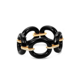 Bold and sophisticated chain link bracelet featuring sleek jet-black onyx links paired with shimmering pavé diamonds, crafted in yellow gold for a luxurious and versatile design that transitions effortlessly from day to night. Close up.
