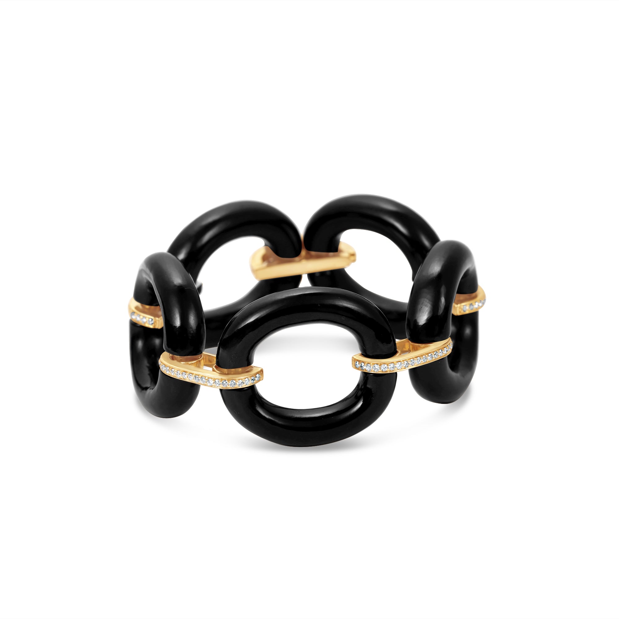 Bold and sophisticated chain link bracelet featuring sleek jet-black onyx links paired with shimmering pavé diamonds, crafted in yellow gold for a luxurious and versatile design that transitions effortlessly from day to night. Close up.