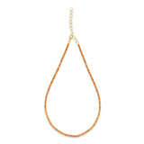 Elegant 14K yellow gold tennis necklace featuring a stunning array of vibrant orange sapphires, highlighting their radiant beauty with exceptional craftsmanship and bold sophistication. 