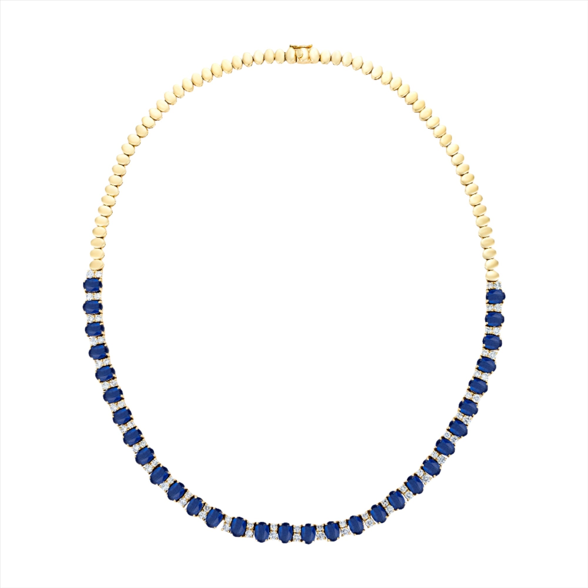 Stunning 14K yellow gold tennis necklace featuring 15.5ct of royal blue oval sapphires and 64 round 2.5mm solitaire diamonds, totaling 16 inches in length—a timeless and regal gemstone piece.