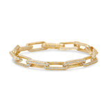 Timeless paperclip bracelet crafted in 14K yellow gold, featuring oblong links adorned with sparkling pavé diamonds, perfect for adding elegance to any outfit.