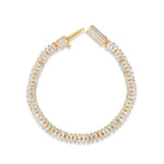 Versatile slinky bracelet crafted in 14K yellow gold, featuring dazzling diamond rondelles in pavé settings, offering timeless elegance and the perfect gift option. Open clasp top down / side image