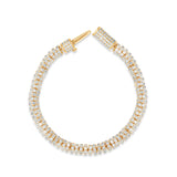 Versatile slinky bracelet crafted in 14K yellow gold, featuring dazzling diamond rondelles in pavé settings, offering timeless elegance and the perfect gift option. Open clasp top down / side image