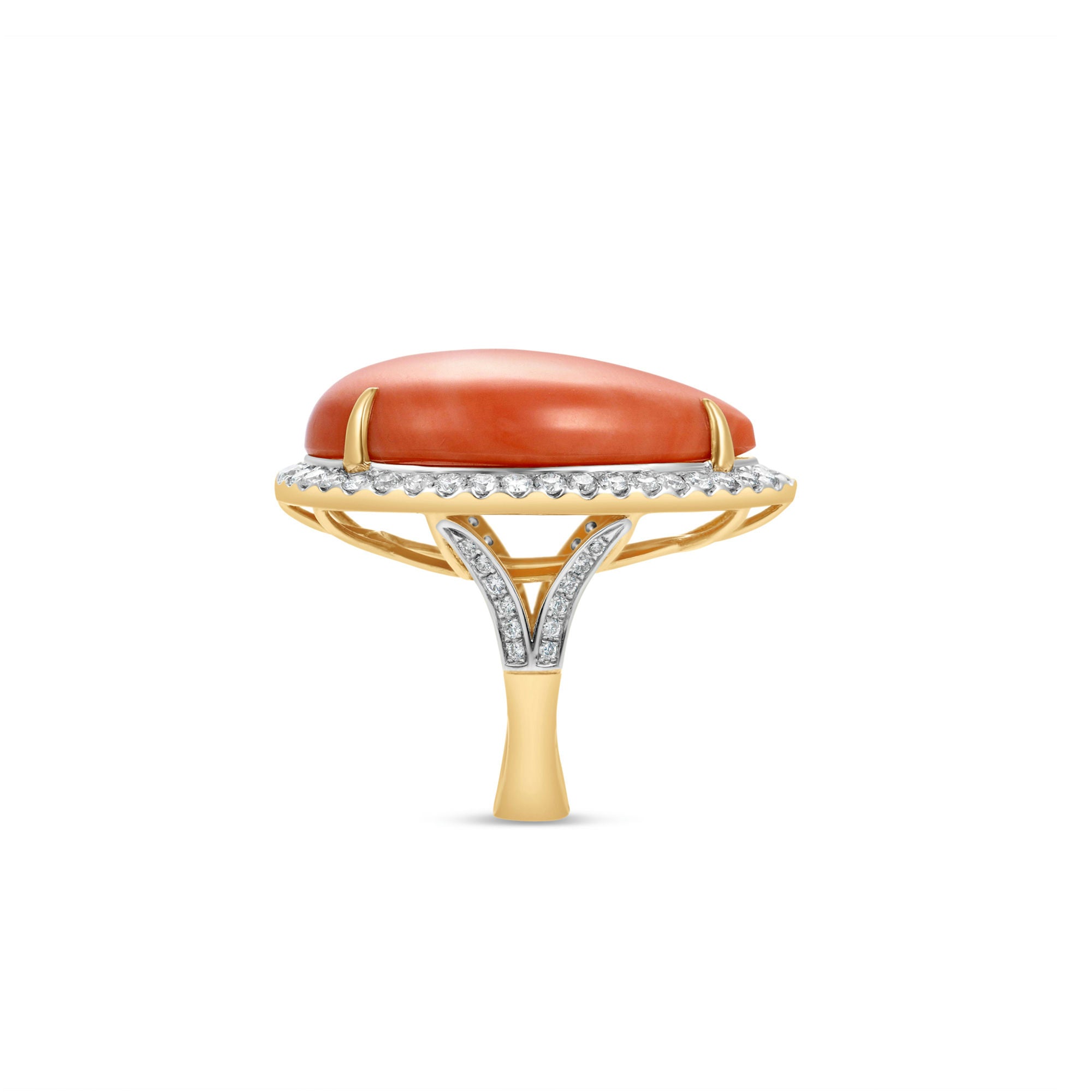 Stunning 18K yellow gold statement ring featuring a captivating pear-shaped coral cabochon, elegantly framed by a halo of brilliant diamonds, blending natural warmth with luxurious sparkle. Side view close up