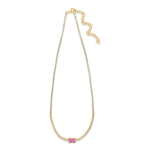 Stunning 14K yellow gold tennis necklace featuring a vibrant emerald-cut pink sapphire centerpiece framed by brilliant diamonds, offering a sophisticated blend of luxury and charm. 
