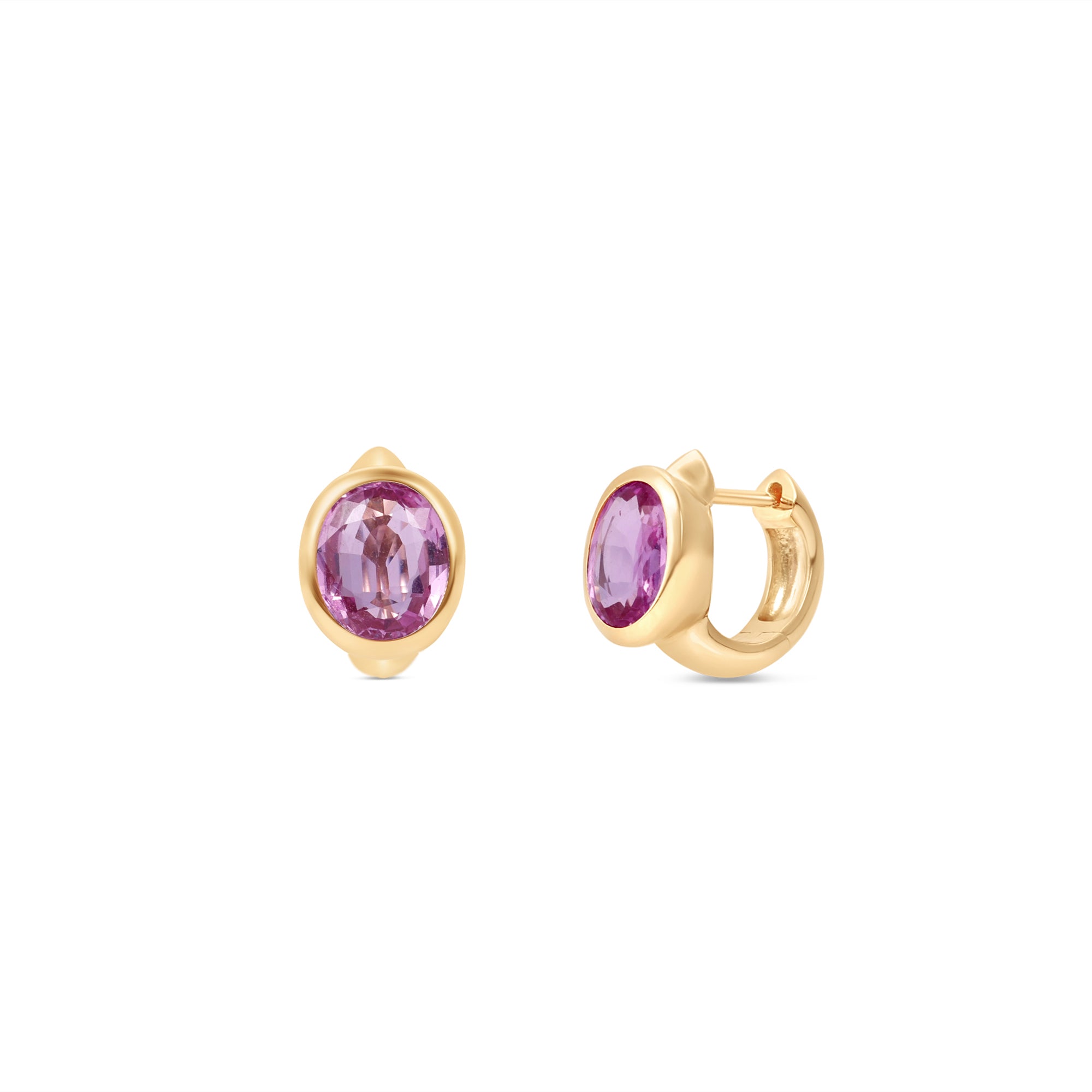 Enchanting pink sapphire huggie earrings crafted in 14K yellow gold, featuring vibrant oval-cut pink sapphires for a perfect blend of charm and sophistication, suitable for any occasion. Front and side views, close up .