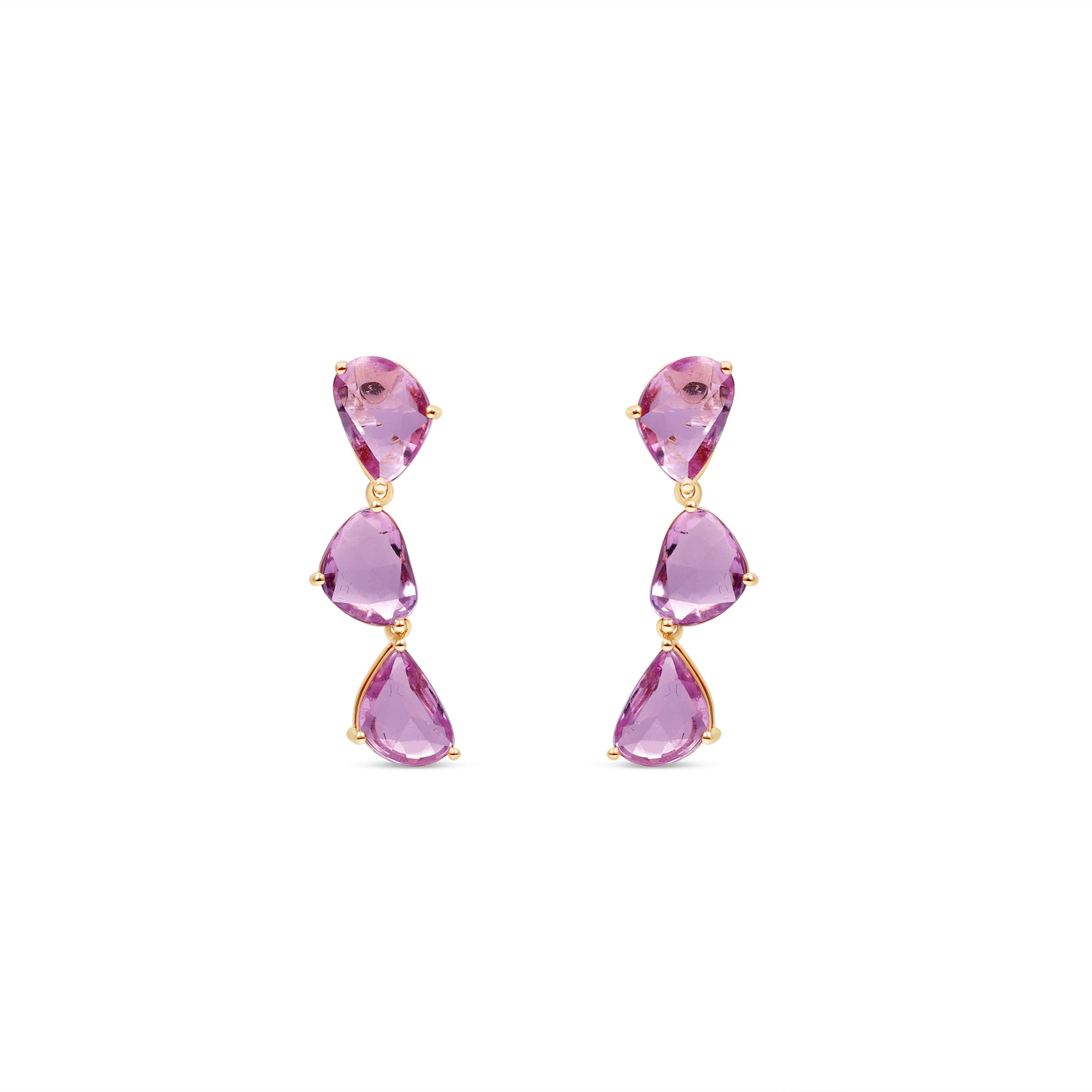 Dazzling pink sapphire drop earrings featuring three luminous sapphires totaling approximately 2ct, elegantly set in 14K yellow gold for a timeless blend of charm and sophistication. Front view, close up. 