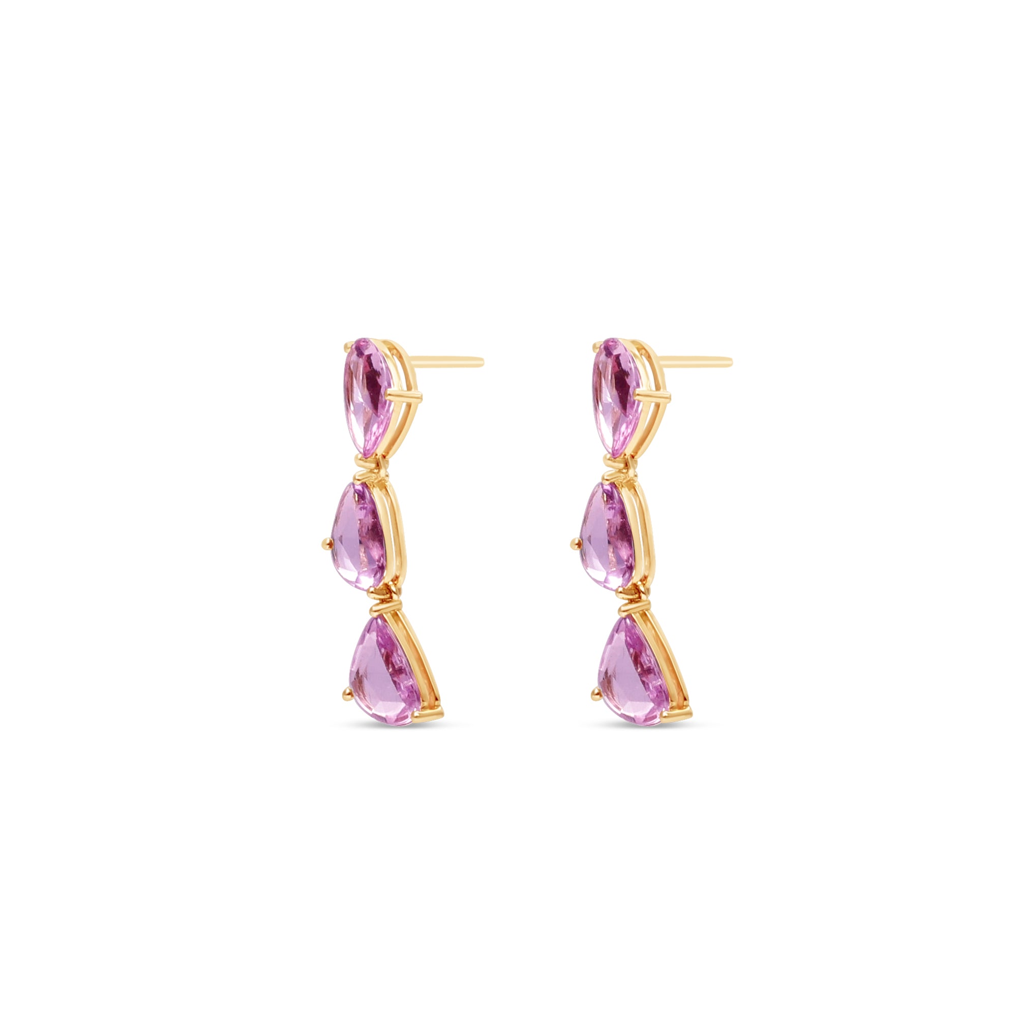 Dazzling pink sapphire drop earrings featuring three luminous sapphires totaling approximately 2ct, elegantly set in 14K yellow gold for a timeless blend of charm and sophistication. Side view.
