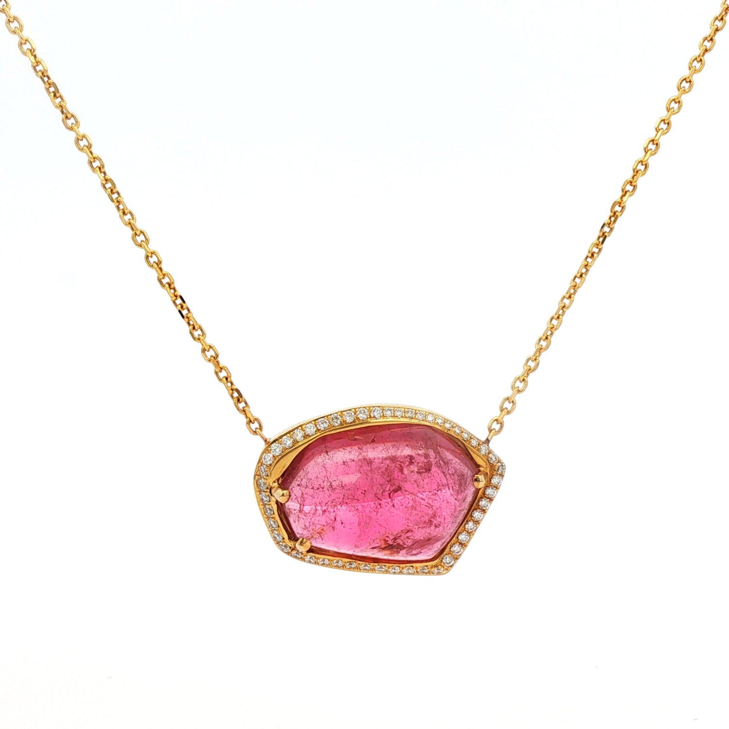 Elegant jelly-style pendant featuring an 11.86ct freeform pink tourmaline surrounded by a 0.45ct diamond halo, set in 18K yellow gold with an adjustable 16–18 inch chain.