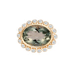Elegant 14K yellow gold cocktail ring featuring an 8.17ct prasiolite (green amethyst) surrounded by a delicate diamond halo, set in a sophisticated basket setting for a refined statement look.