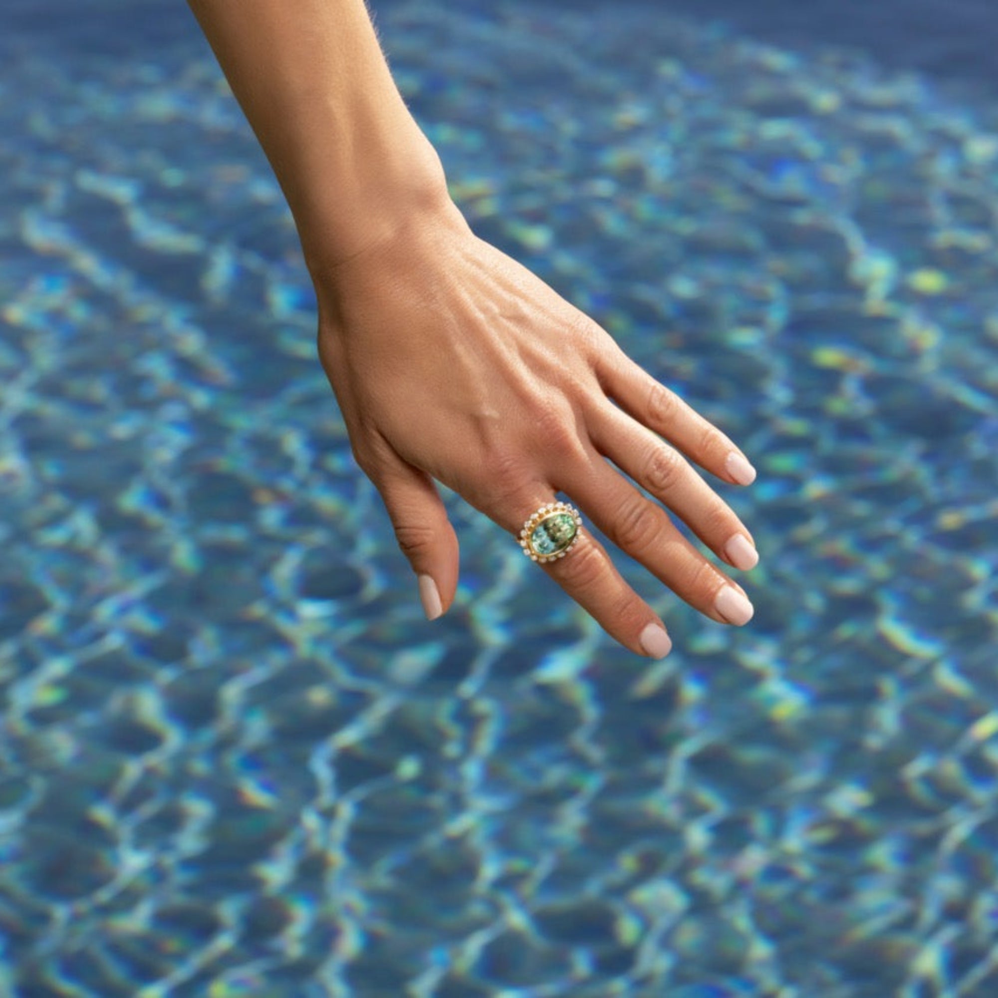 Elegant 14K yellow gold cocktail ring featuring an 8.17ct prasiolite (green amethyst) surrounded by a delicate diamond halo, set in a sophisticated basket setting for a refined statement look.