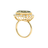 Elegant 14K yellow gold cocktail ring featuring an 8.17ct prasiolite (green amethyst) surrounded by a delicate diamond halo, set in a sophisticated basket setting for a refined statement look.