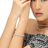 Stunning 14K yellow gold tennis bracelet featuring 2.21ct of princess-cut pink sapphires and 1.45ct of sparkling G-H VS diamonds. Measuring 7 inches in length and weighing 21.46g, this bracelet delivers a bold yet elegant pop of color.