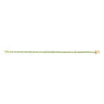 Delicate 14K yellow gold tennis bracelet featuring round bezel-set emeralds totaling 1.12ct. Lightweight at 6.1g, this refined bracelet offers timeless elegance with a pop of green.