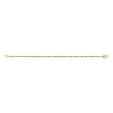 Delicate 14K yellow gold tennis bracelet featuring round bezel-set emeralds totaling 1.12ct. Lightweight at 6.1g, this refined bracelet offers timeless elegance with a pop of green.