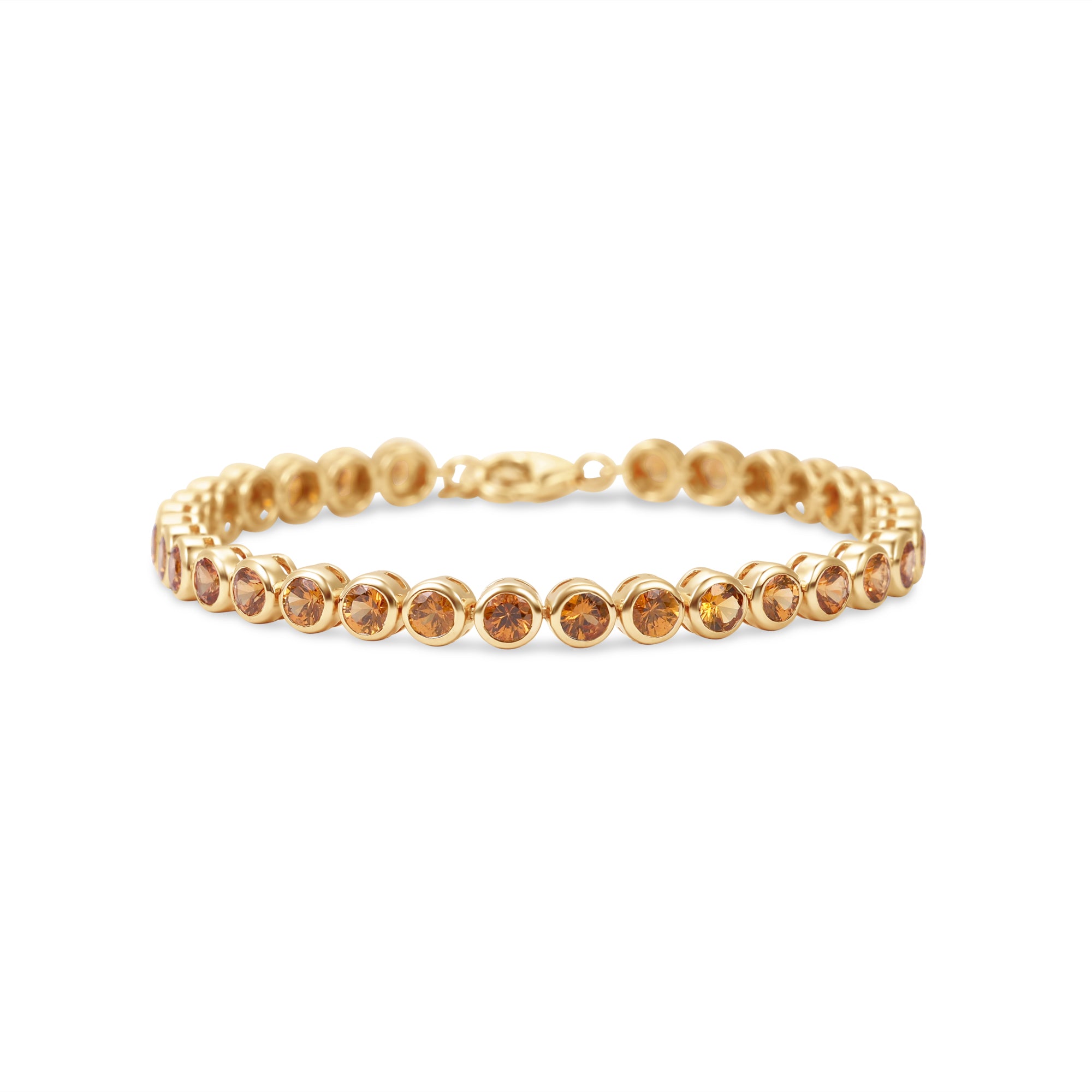 Stunning orange sapphire tennis bracelet featuring round bezel-set sapphires in 14K gold, offering a bold yet elegant statement of luxury.