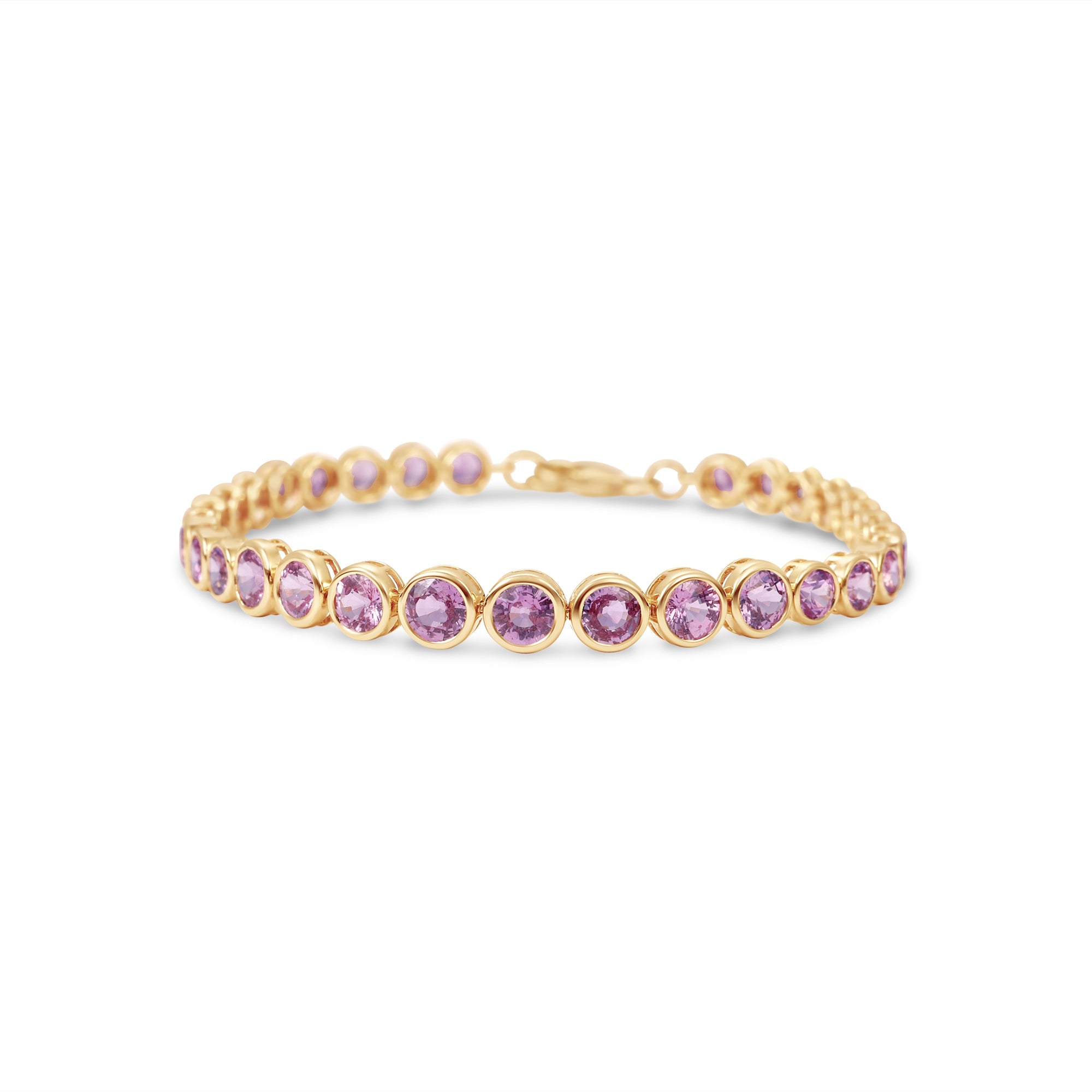 Charming pink sapphire tennis bracelet featuring vibrant round bezel-set sapphires in 14K yellow gold, designed for elegance and romance.