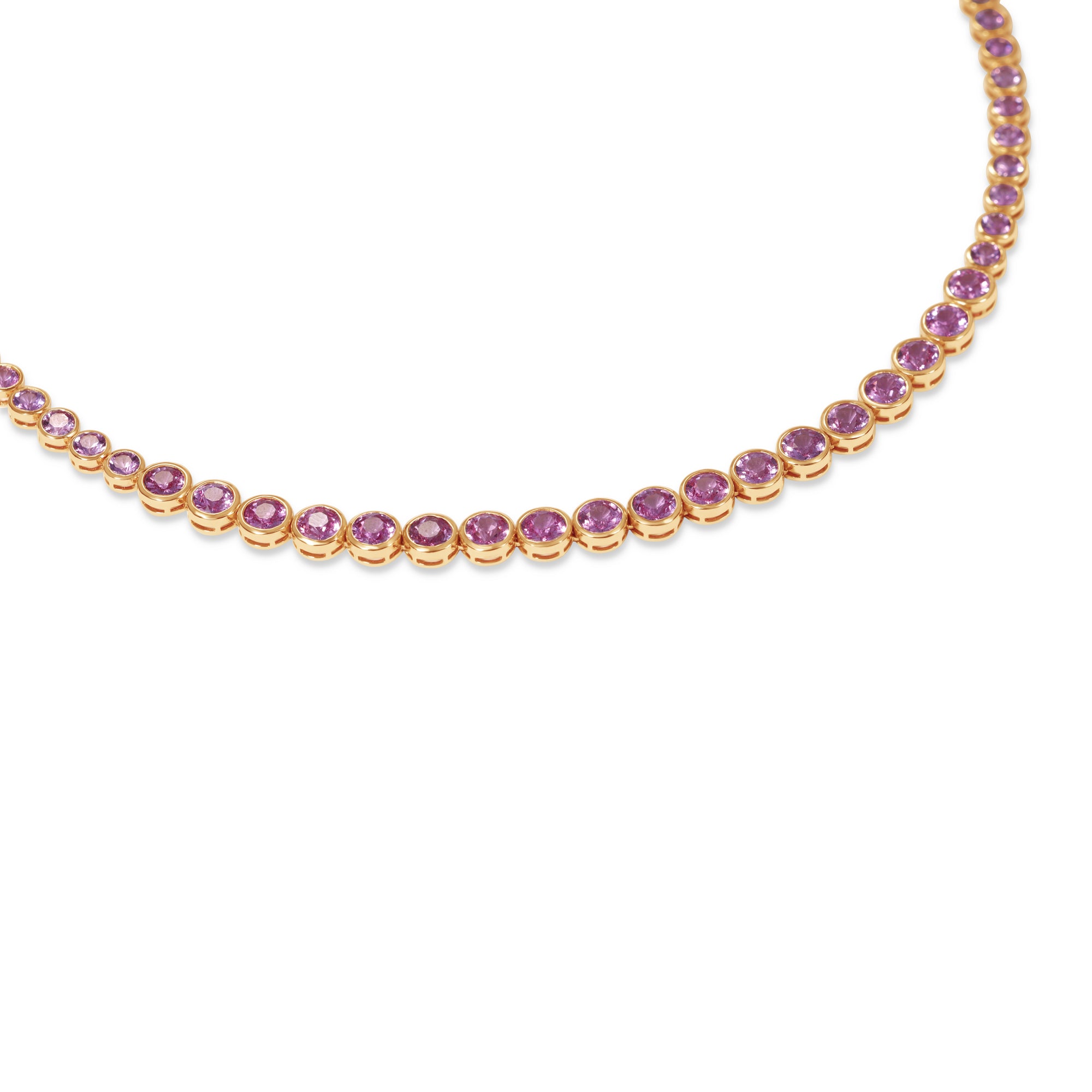 Elegant 14K yellow gold tennis necklace featuring vibrant round-cut pink sapphires in secure bezel settings, offering timeless beauty with a modern edge. Close up. 