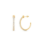 Delicate open hoop earrings crafted in radiant 14K yellow gold, featuring sparkling prong-set diamonds for a versatile and elegant touch of brilliance. Close up and angled front and side shots. 
