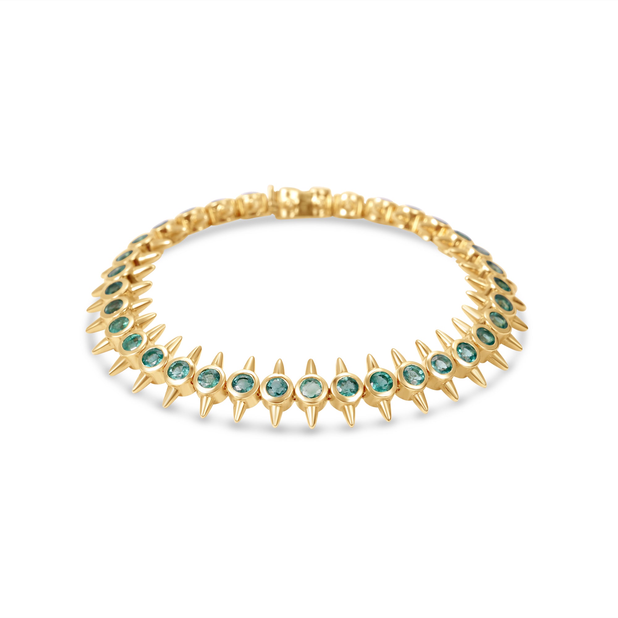Striking 14K yellow gold bracelet featuring bezel-set vibrant emeralds in edgy, spiked links, blending modern sophistication with a bold, daring aesthetic.