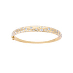 Elegant 14K yellow gold bangle featuring a radiant spray of diamonds totaling 2.52ct, with a refined, sculptural design and a total weight of 15.02g.