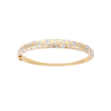 Elegant 14K yellow gold bangle featuring a radiant spray of diamonds totaling 2.52ct, with a refined, sculptural design and a total weight of 15.02g.