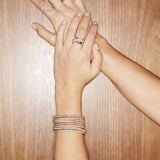 Luxurious stretch diamond tennis bracelet featuring G-H color, VS clarity diamonds in flexible settings. Available in multiple sizes, from 2.75ct to 9ct, for a perfect, comfortable fit with timeless brilliance.  on model 