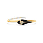 Captivating serpent bangle crafted in radiant 14K yellow gold, featuring a striking black enamel design accented with shimmering graduated diamonds, exuding bold sophistication and elegance.
