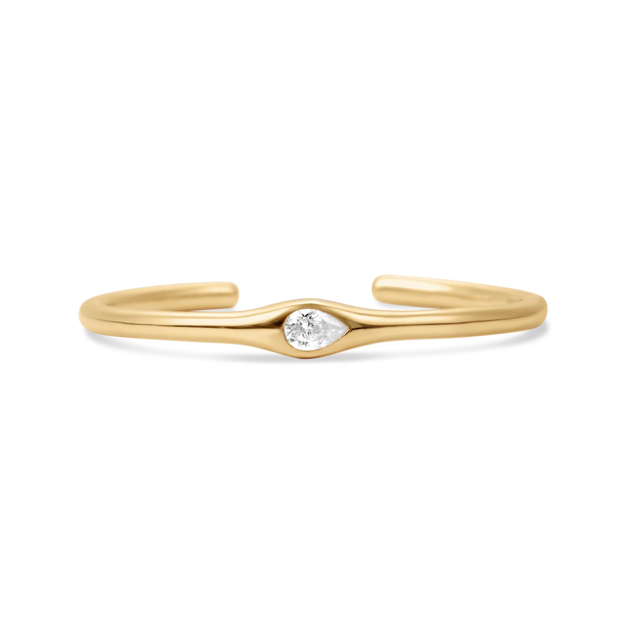 Sleek 14K yellow gold tapered cuff bracelet featuring a graceful pear-shaped solitaire diamond, blending modern minimalism with timeless elegance